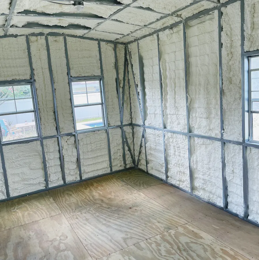 Closed-cell spray foam insulation applied to wall cavities in a residential project in Coppell